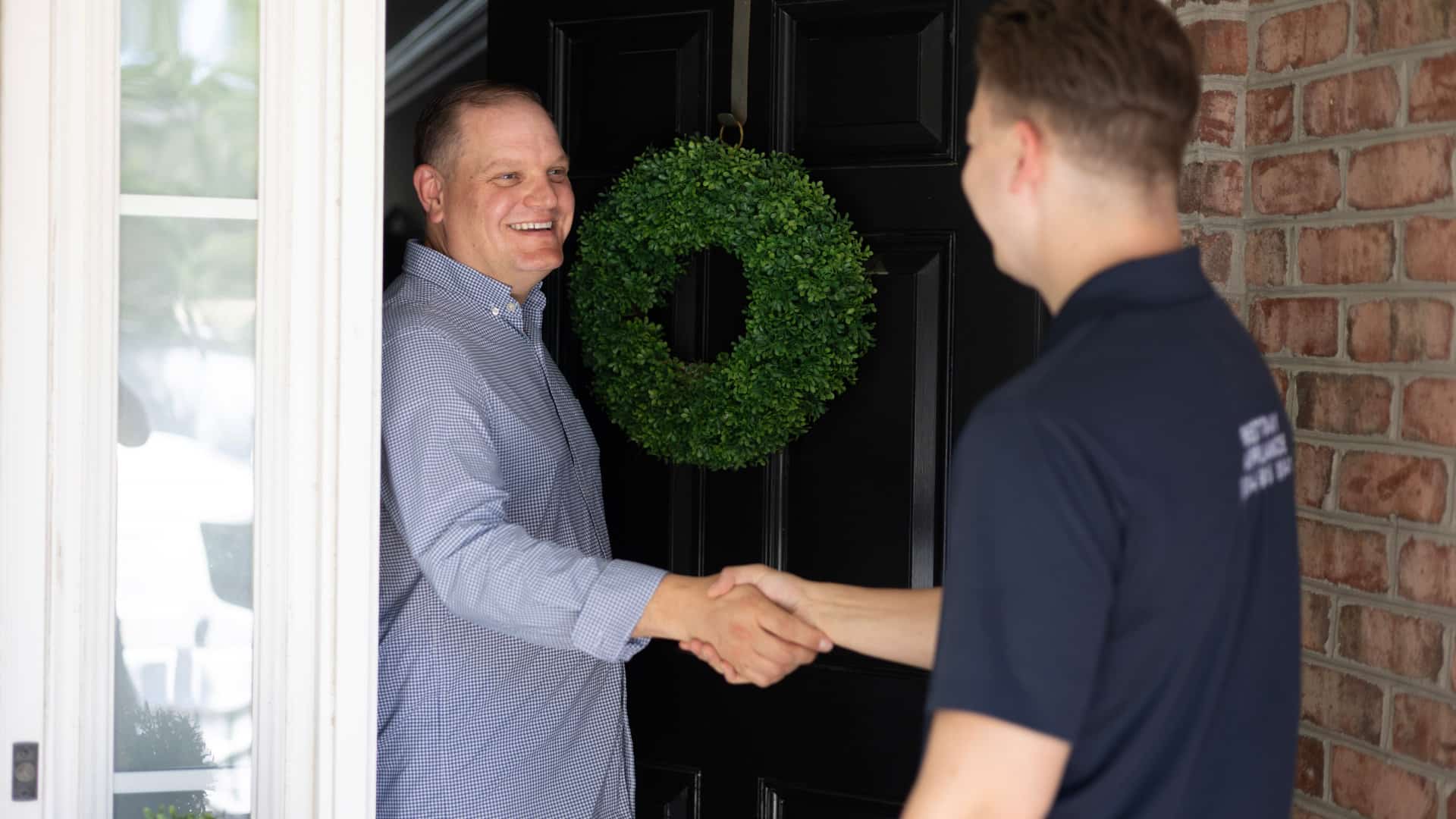 Best Day Appliance technician at a customer's front door